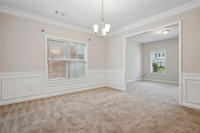 2040 Village Green Dr, Fairburn, GA 30213 - carpeted empty room featuring a chandelier, ornamental molding, a wainscoted wall, and a decorative wall