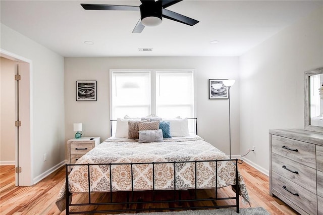 bedroom featuring light hardwood / wood-style floors and ceiling fan