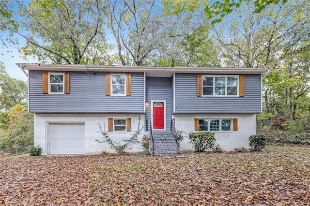 raised ranch featuring a garage