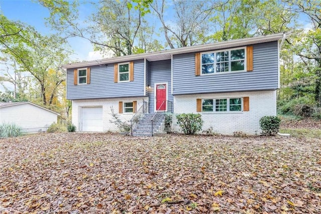 split foyer home featuring a garage