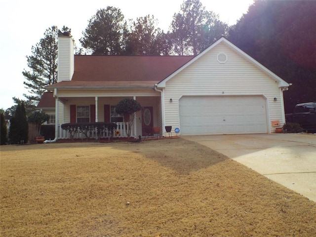 view of front of house with a garage, a porch, and a front yard