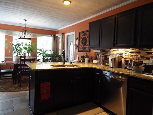 kitchen featuring sink, light stone counters, crown molding, stainless steel dishwasher, and pendant lighting