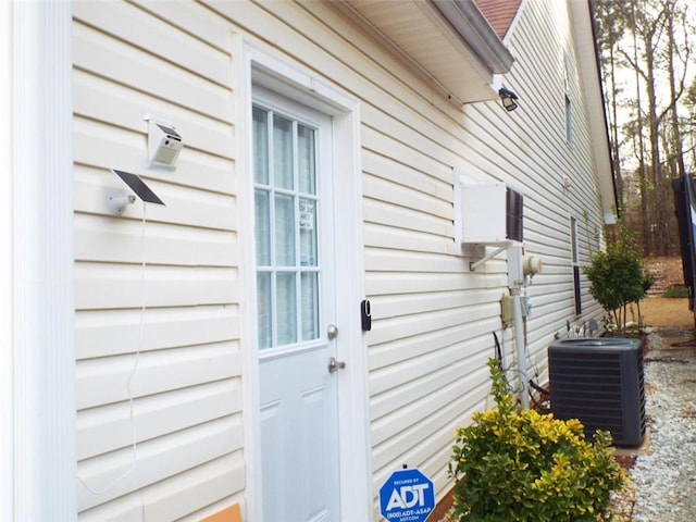 entrance to property with central AC unit