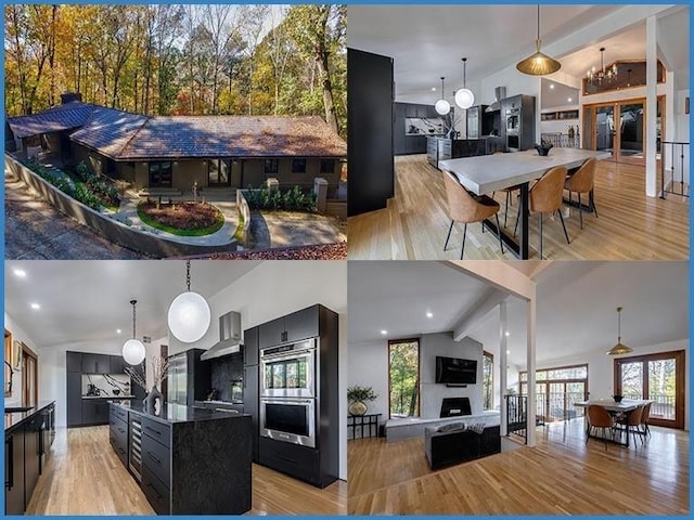 kitchen with vaulted ceiling, double oven, decorative light fixtures, a center island, and light hardwood / wood-style floors