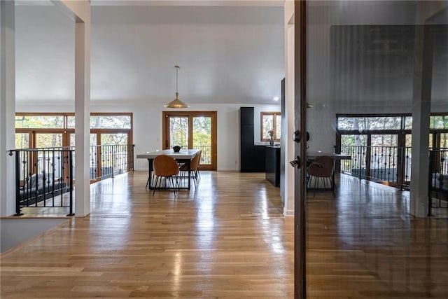 dining area featuring wood-type flooring and french doors