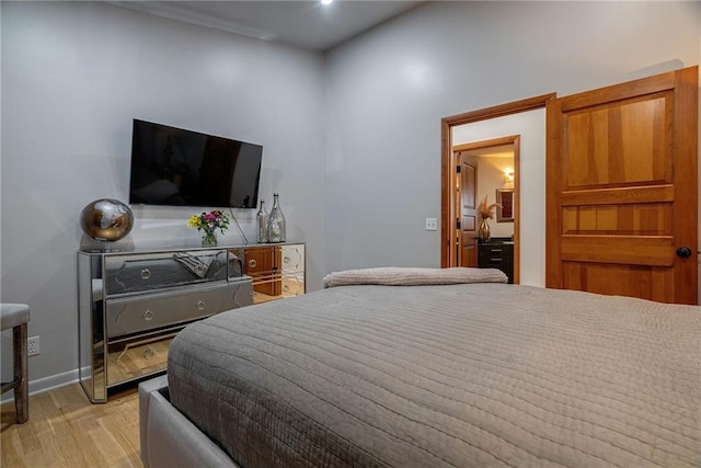 bedroom with light hardwood / wood-style flooring