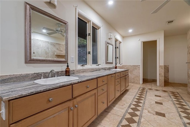 bathroom with tile patterned floors, ceiling fan, and vanity