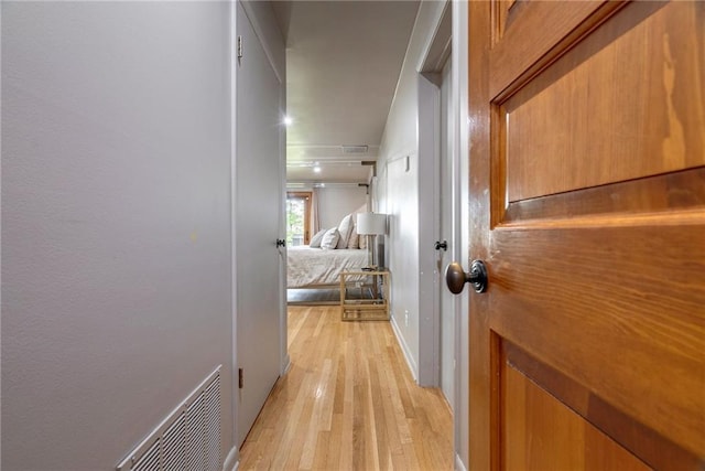 hall with light hardwood / wood-style floors