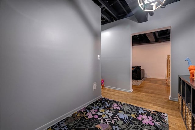 corridor with wood-type flooring