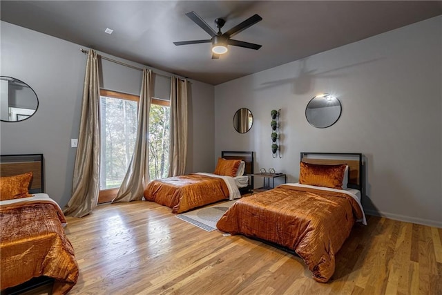 bedroom featuring light wood-type flooring and ceiling fan