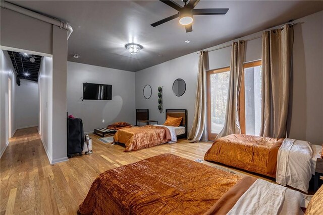 bedroom featuring ceiling fan and light wood-type flooring