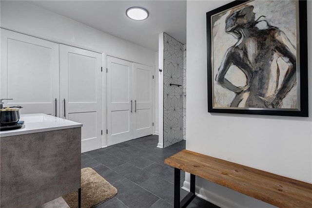 interior space featuring tile patterned flooring and vanity