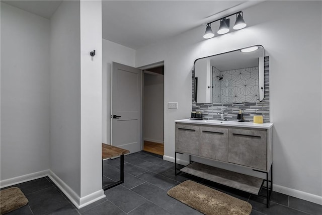 bathroom featuring backsplash, tile patterned floors, and vanity