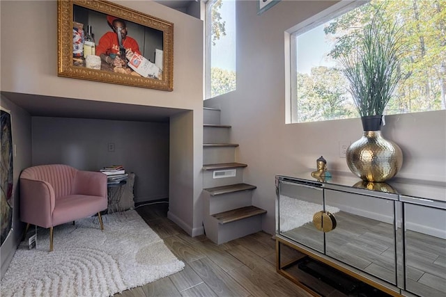 living area with hardwood / wood-style flooring