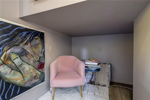 sitting room with hardwood / wood-style floors