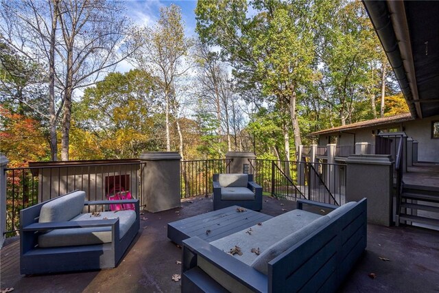 wooden terrace featuring an outdoor living space