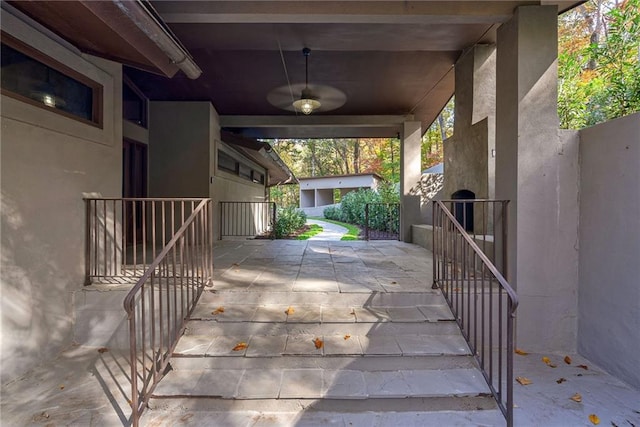 exterior space with ceiling fan