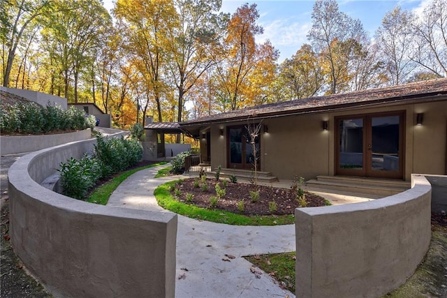 back of house featuring french doors