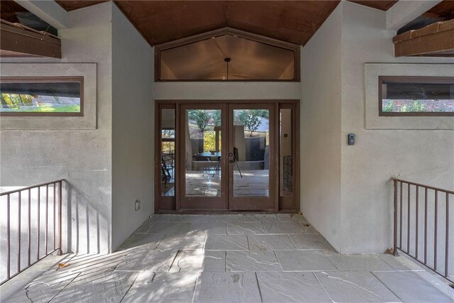 view of exterior entry featuring french doors