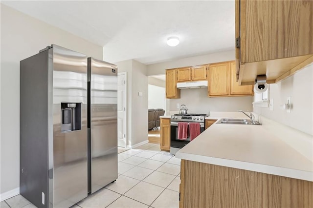 kitchen with light brown cabinets, light tile patterned floors, sink, and appliances with stainless steel finishes