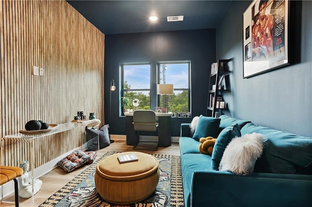 cinema room with light hardwood / wood-style flooring