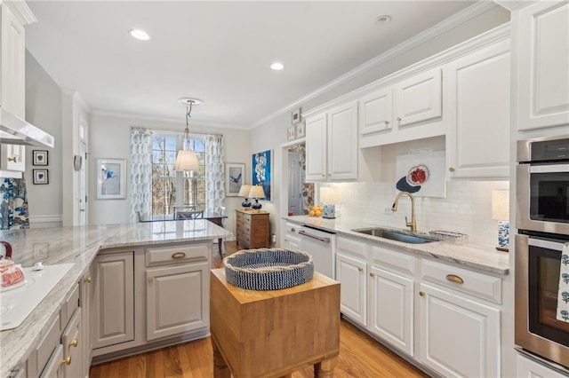 5807 Peacock Ln, Hoschton, GA 30548 - kitchen with light wood-type flooring, ornamental molding, white appliances, white cabinetry, and a sink