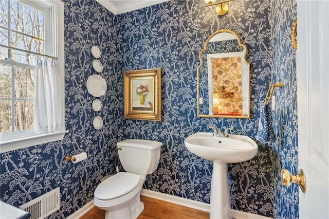 5807 Peacock Ln, Hoschton, GA 30548 - half bath featuring visible vents, baseboards, toilet, and wood finished floors