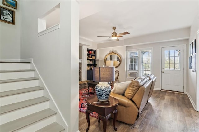 5807 Peacock Ln, Hoschton, GA 30548 - living area featuring a ceiling fan, stairway, wood finished floors, and baseboards
