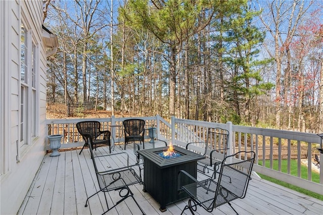 5807 Peacock Ln, Hoschton, GA 30548 - deck with an outdoor fire pit