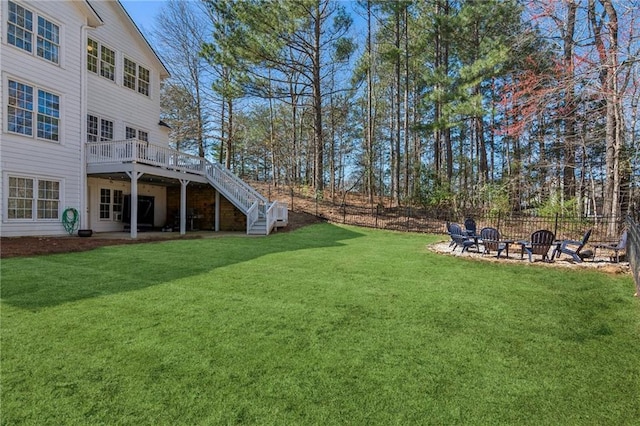 5807 Peacock Ln, Hoschton, GA 30548 - view of yard with a patio, stairway, fence, an outdoor fire pit, and a wooden deck