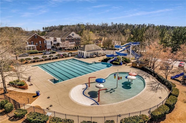 5807 Peacock Ln, Hoschton, GA 30548 - pool featuring a water play area, a water slide, a patio, and fence