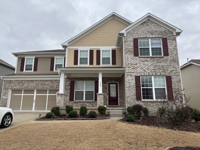 craftsman-style home with a garage and covered porch