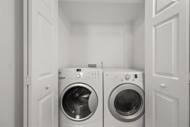 laundry room with washer and dryer