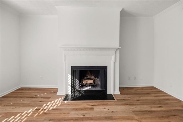 interior details with hardwood / wood-style flooring and crown molding