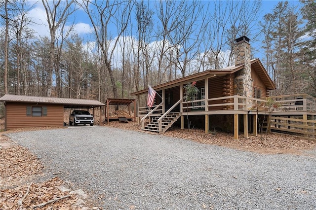 view of property exterior with a carport