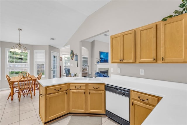 1530 Brisbane Dr, Dacula, GA 30019 - kitchen with dishwasher, lofted ceiling, a chandelier, a peninsula, and light tile patterned flooring