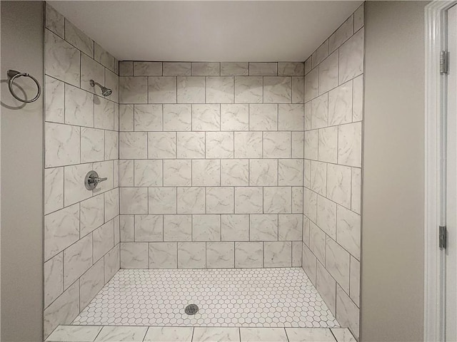 bathroom with a tile shower