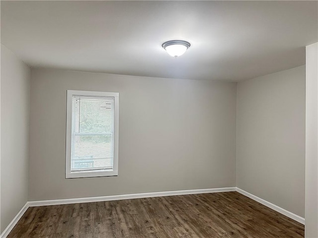 empty room with hardwood / wood-style flooring