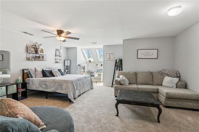 bedroom featuring ceiling fan, visible vents, and carpet