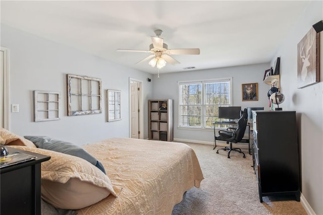 bedroom with baseboards, ceiling fan, visible vents, and carpet