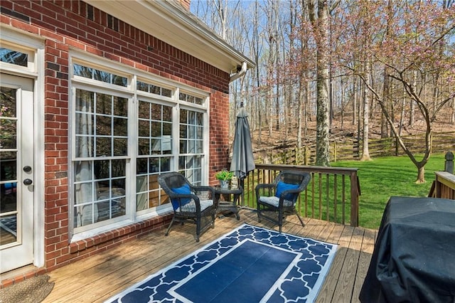 wooden terrace featuring grilling area