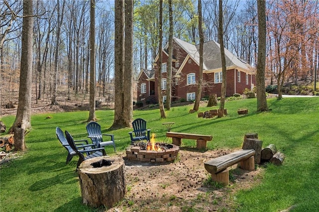 view of yard featuring an outdoor fire pit