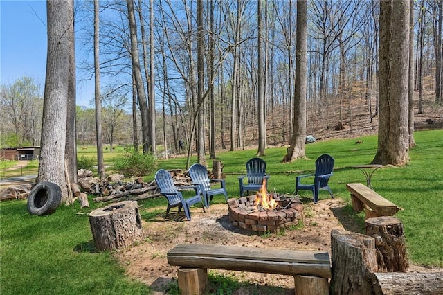 view of yard with a fire pit