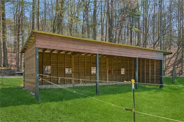 surrounding community featuring an outdoor structure and an exterior structure