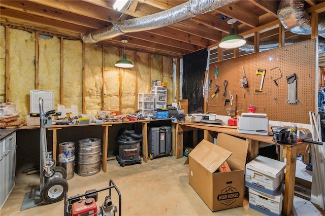 unfinished basement with a workshop area