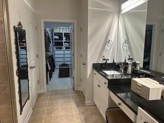 3311 Lindenridge Dr, Buford, GA 30519 - bathroom featuring a sink and a spacious closet