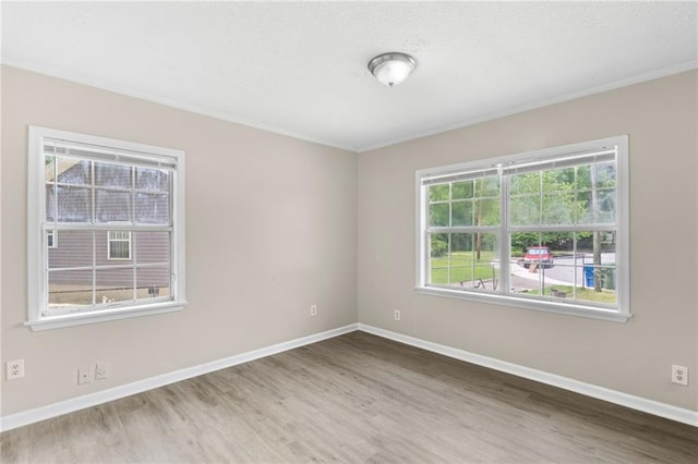 354 Henry Aaron Ave SW, Atlanta, GA 30310 - unfurnished room with wood finished floors, crown molding, and baseboards