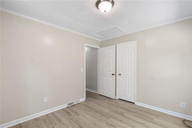 354 Henry Aaron Ave SW, Atlanta, GA 30310 - unfurnished bedroom with wood finished floors, a textured ceiling, baseboards, a closet, and ornamental molding