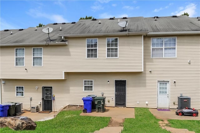 112 Hawkeye Ln, Conyers, GA 30012 - back of house with a patio, central air condition unit, and a yard