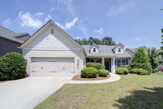 1575 Parkside Village Dr, Cumming, GA 30040 - view of front of home featuring a garage, a front yard, and concrete driveway